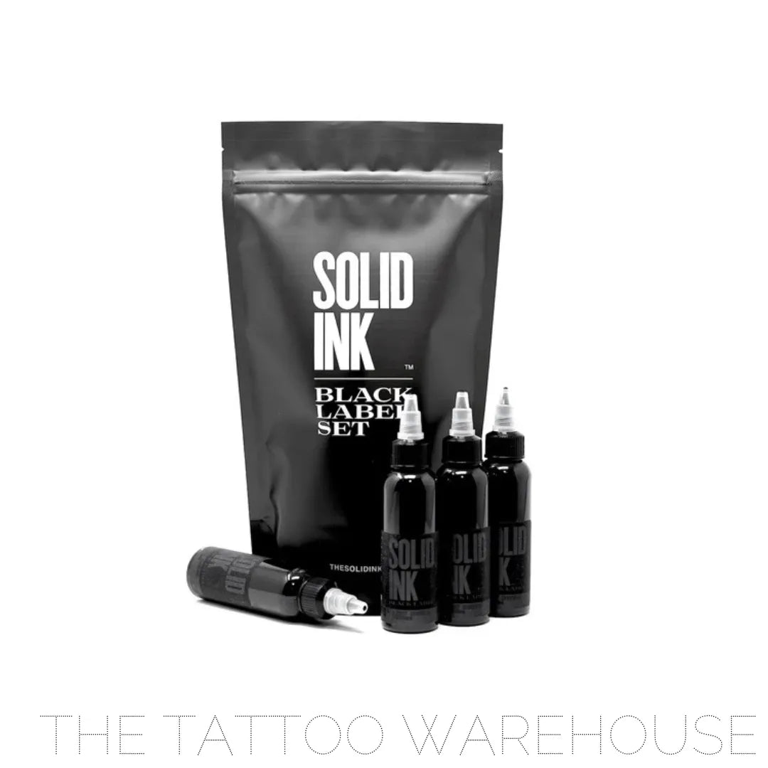 Four bottles of Black Label Greywash set in front of the Solid Ink Black label set bag.