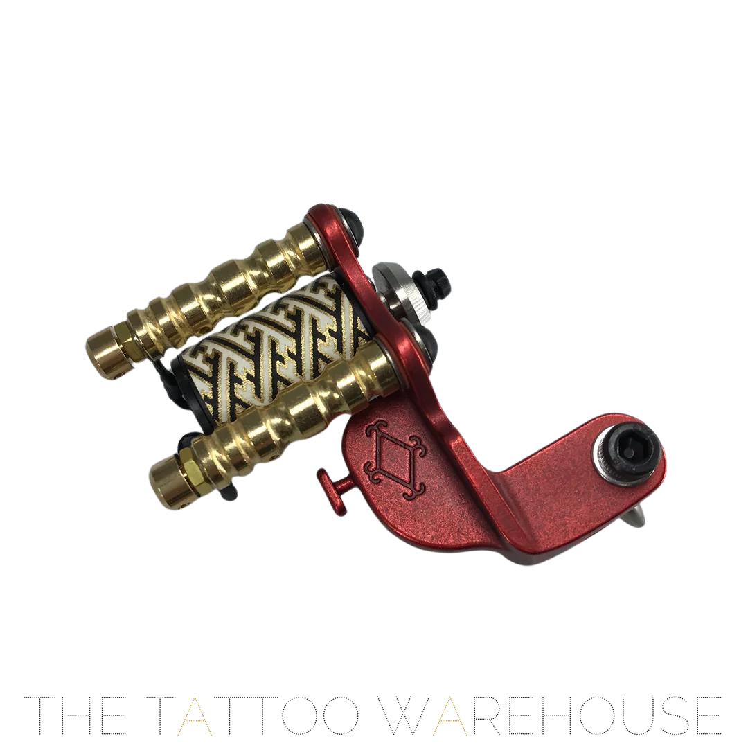 A Beautiful closeup of the Era Higa Quinke V1. Its aluminium frame is red. The MAXXON motor has a geometric pattern originating from Japan. Such a beautiful looking rotary tattoo machine