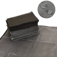 Black dental bib tray liners, stacked pack