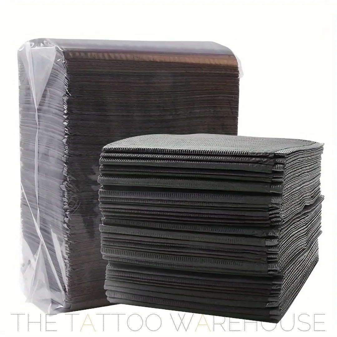 Black dental bib tray liners, close-up