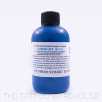 Bottle of Dermaglo Midnight Blue tattoo ink