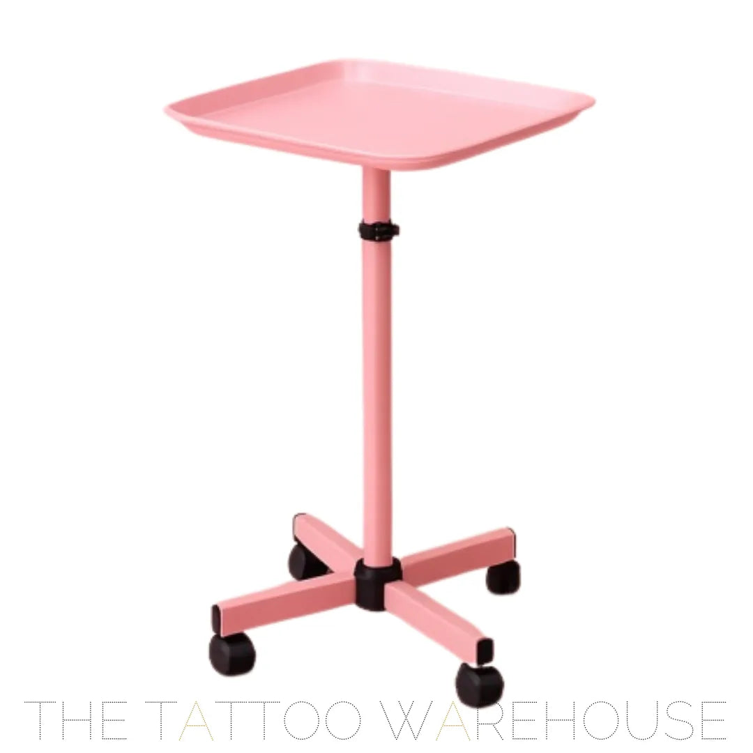 Pink tray station on wheels for tattoo studio