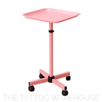 Pink tray station on wheels for tattoo studio