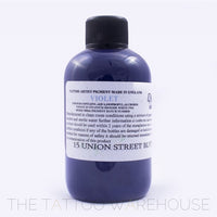 Bottle of Dermaglo Violet tattoo ink