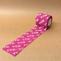 Pink TTW cohesive bandage, wrapped roll