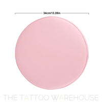 Pink rolling stool, in studio setting